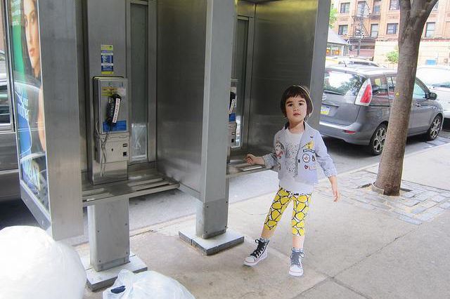 "The last payphone user in New York is a child made of cardboard"